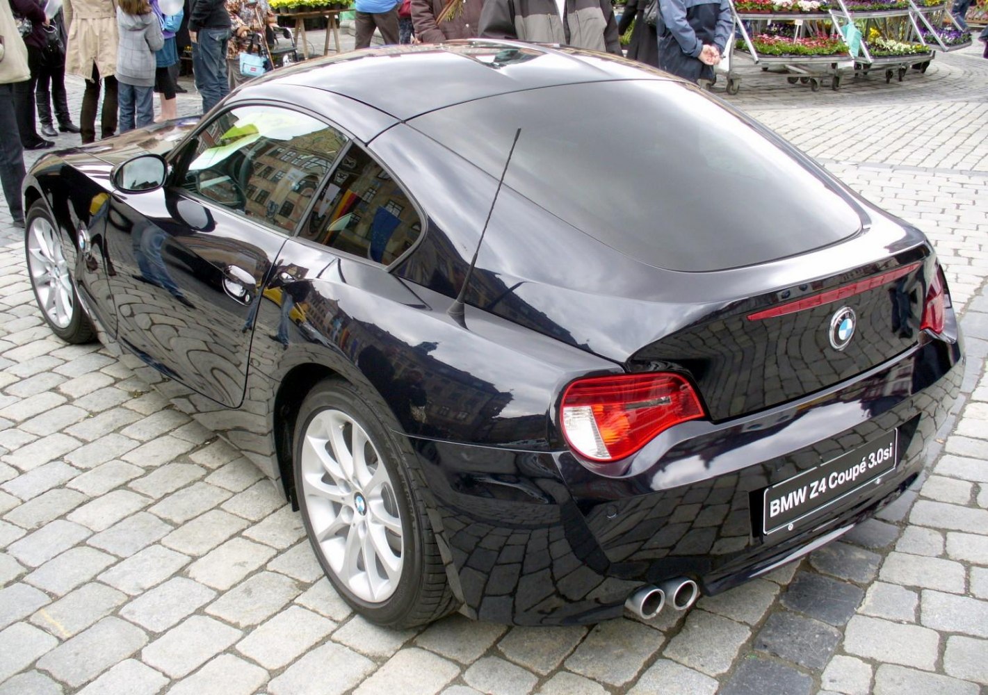 Rear view of sports coupe with dual exhaust and smooth roofline