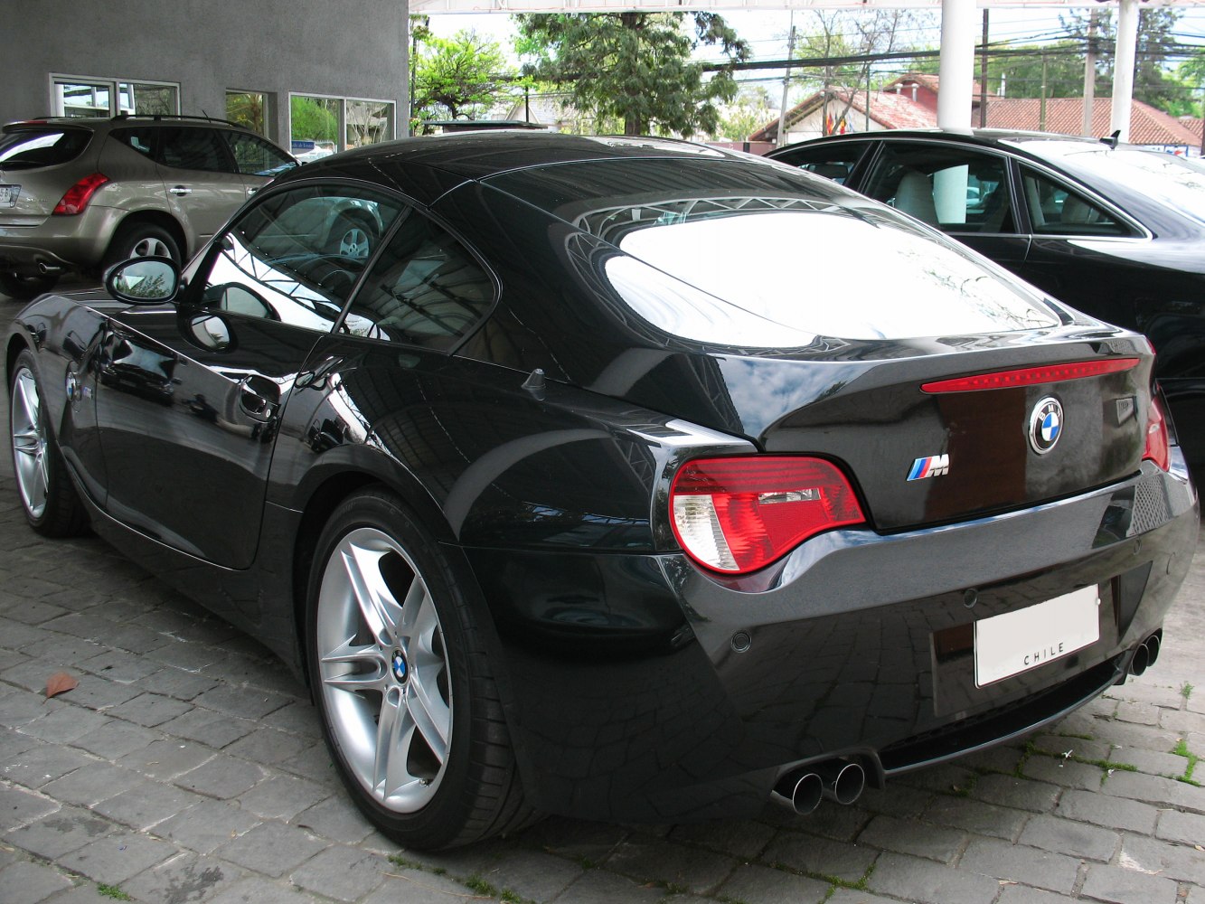 Rear view of a coupe with dual exhaust and distinct tail lights