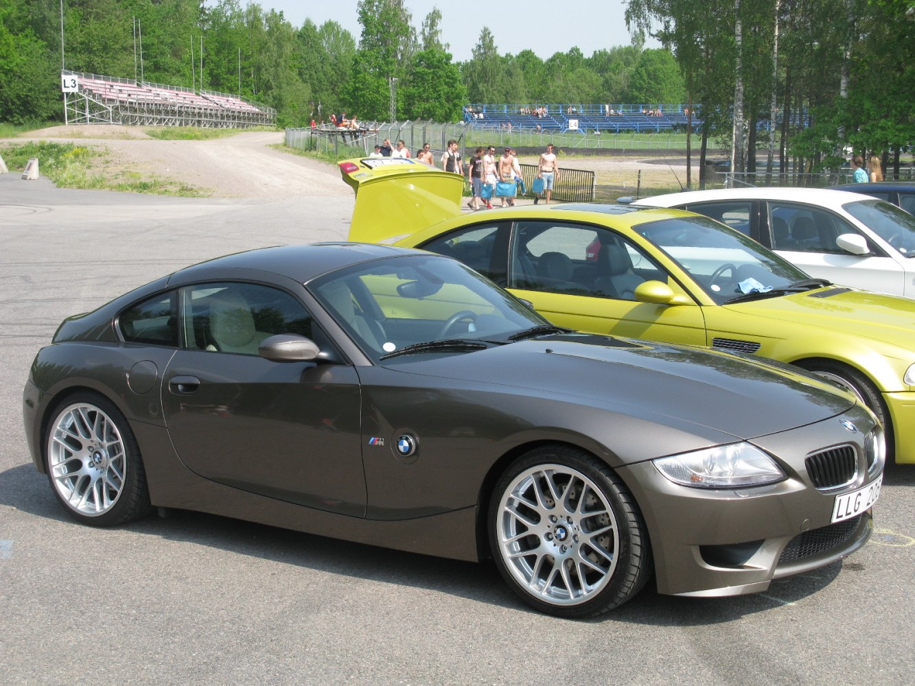 Sporty coupe with alloy wheels in outdoor parking