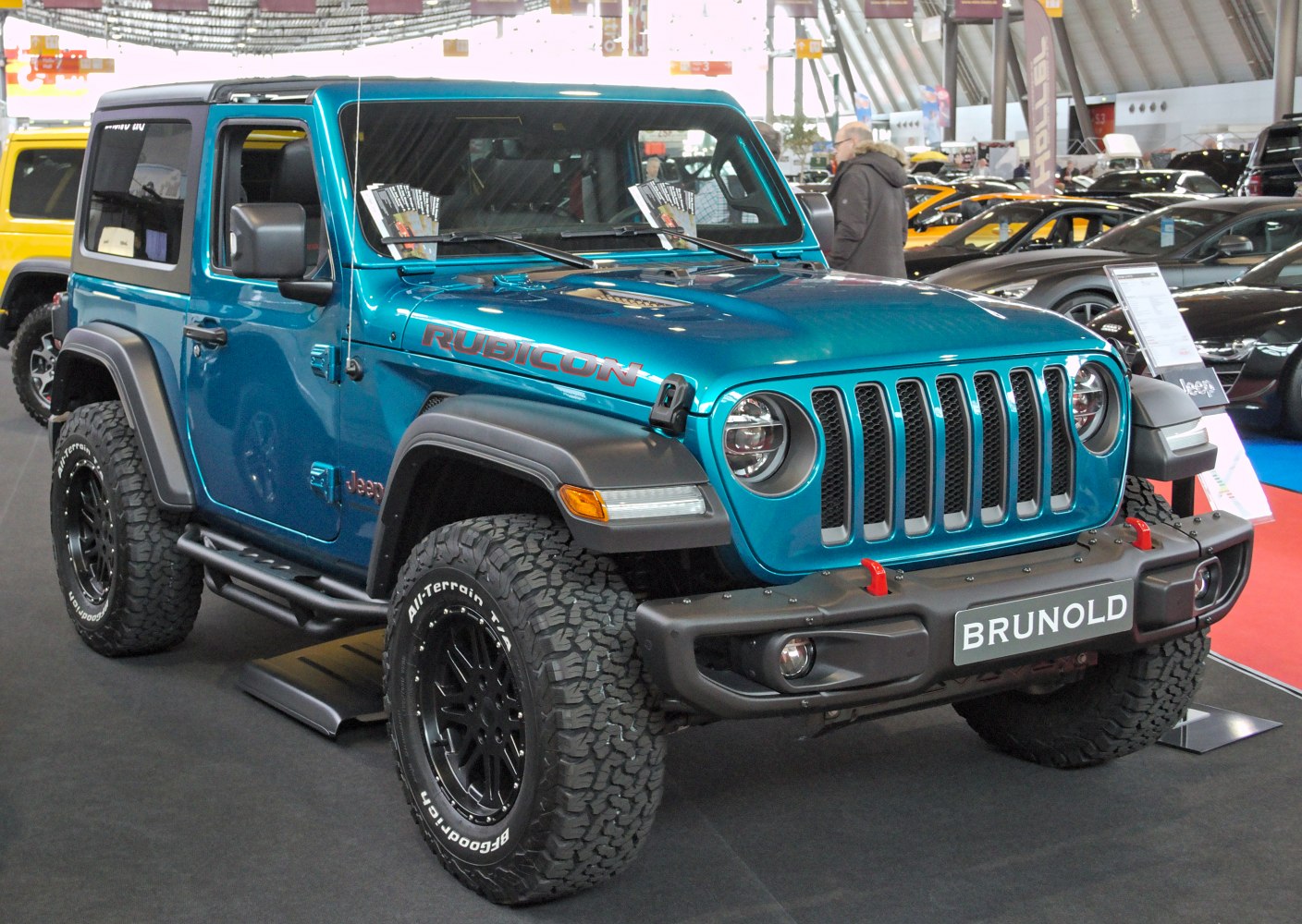 Blue off-road SUV with Rubicon decals and all-terrain tires