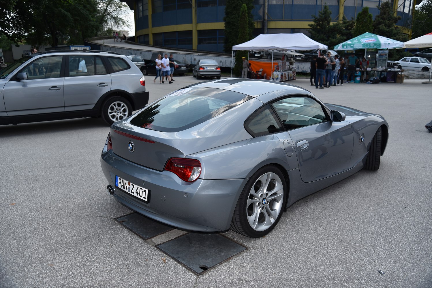 Gray coupe with aerodynamic curves and alloy wheels.