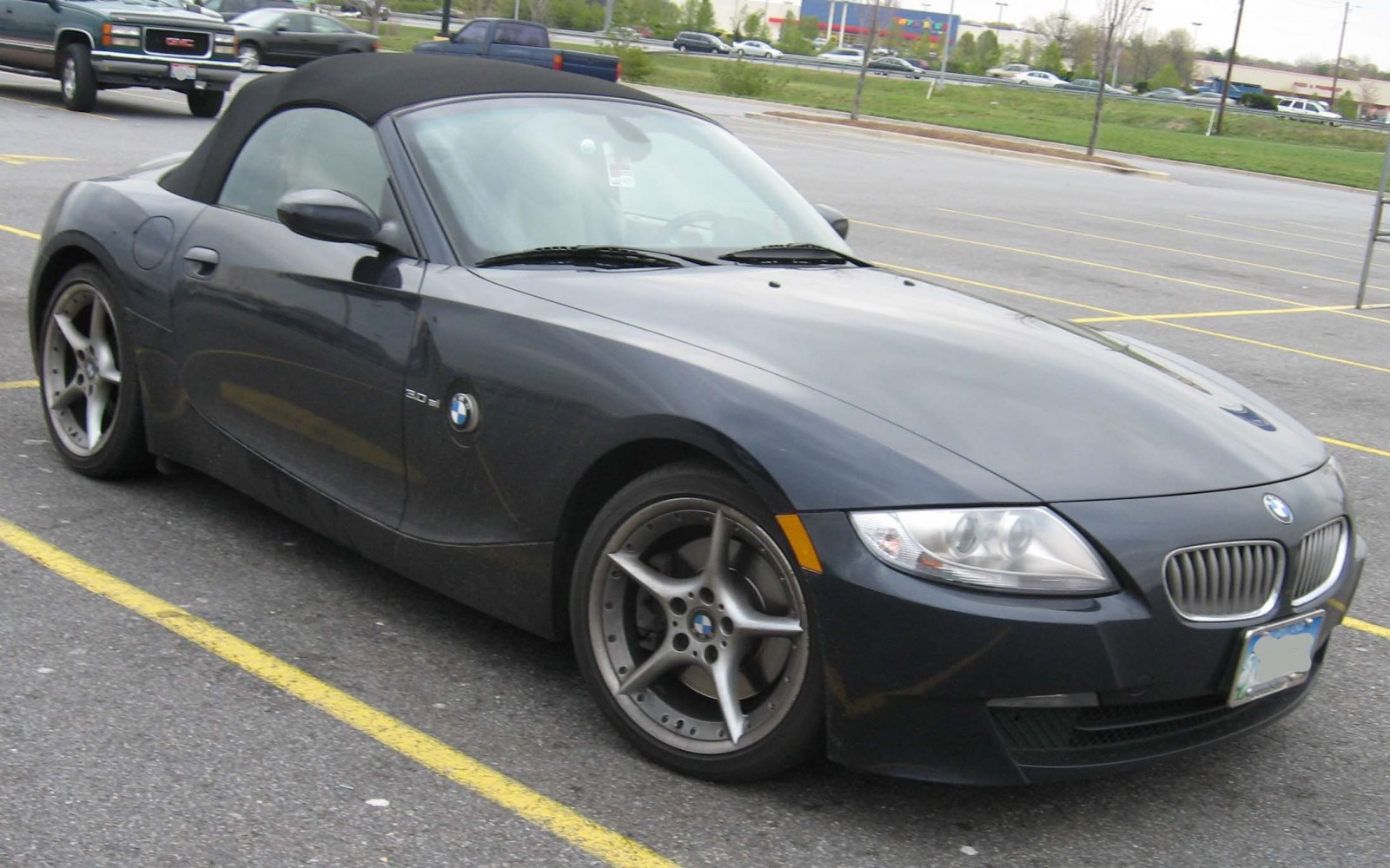 Front-side view of soft top roadster with alloy wheels