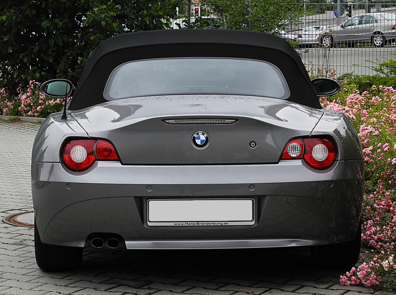 Convertible rear with soft top, dual exhausts, and round taillights