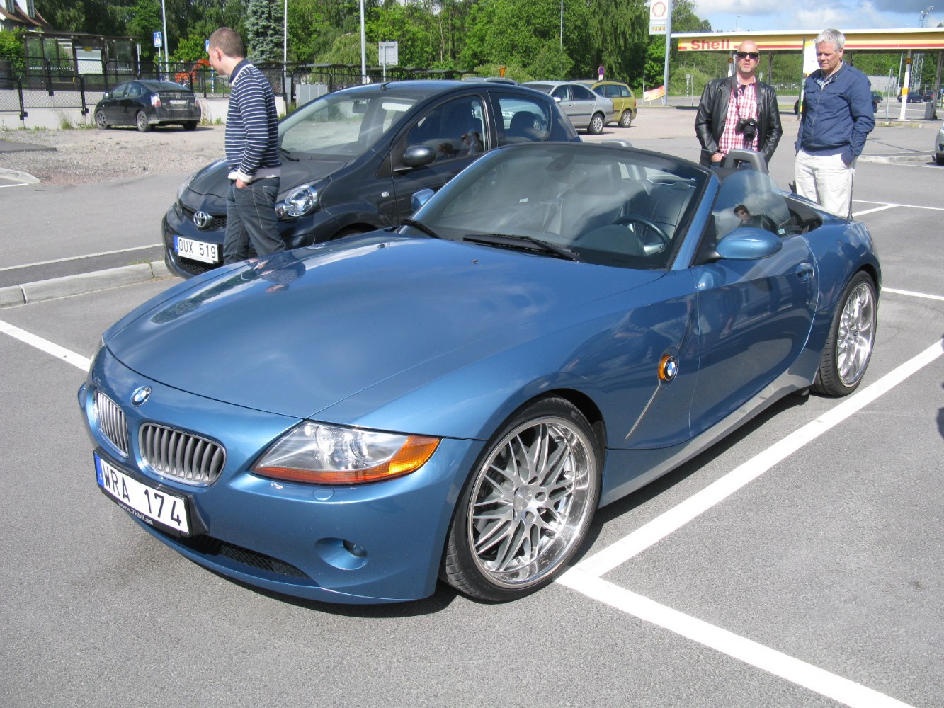 Blue convertible with sporty alloy wheels and distinctive front design