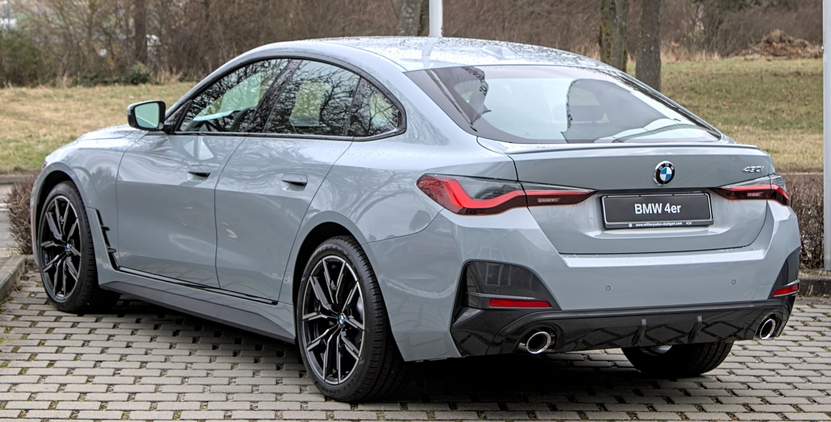 Rear and side view of a sporty Gran Coupe with sharp taillights and black alloy wheels