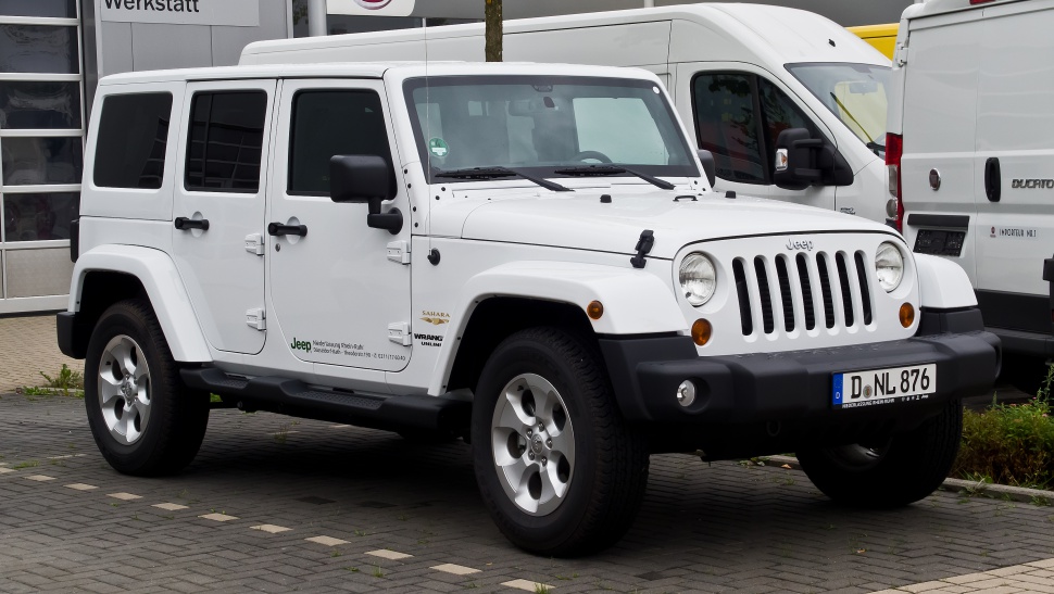 White white 4-door off-road SUV with vertical grille and round headlights