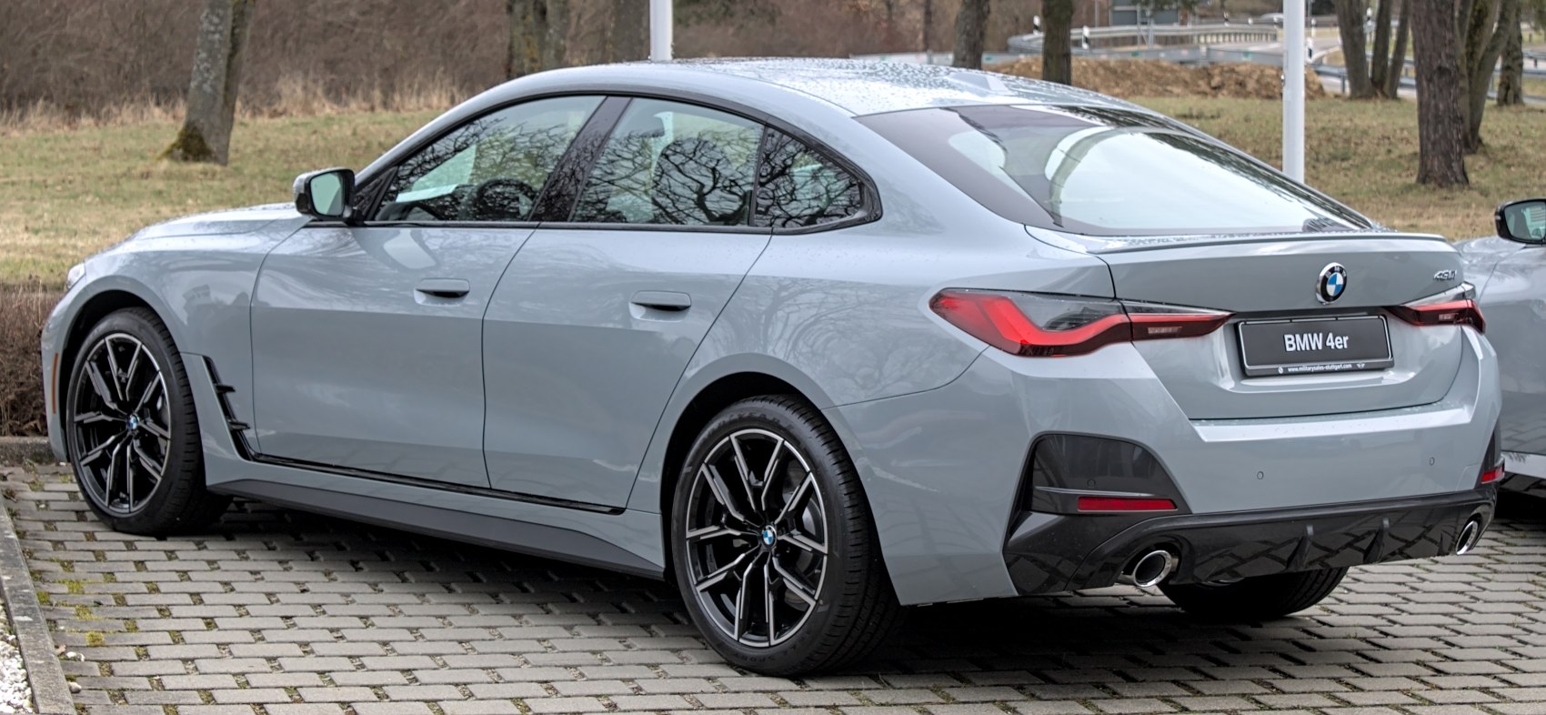 Rear and side profile with distinctive tail lights and dual exhaust