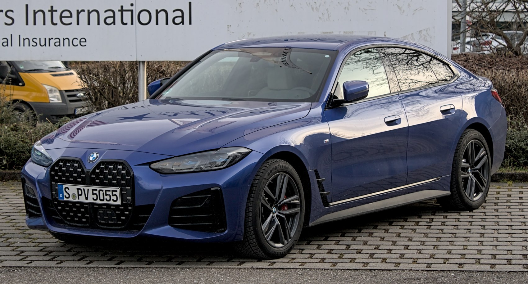 Large kidney grille and sleek side profile with alloy wheels