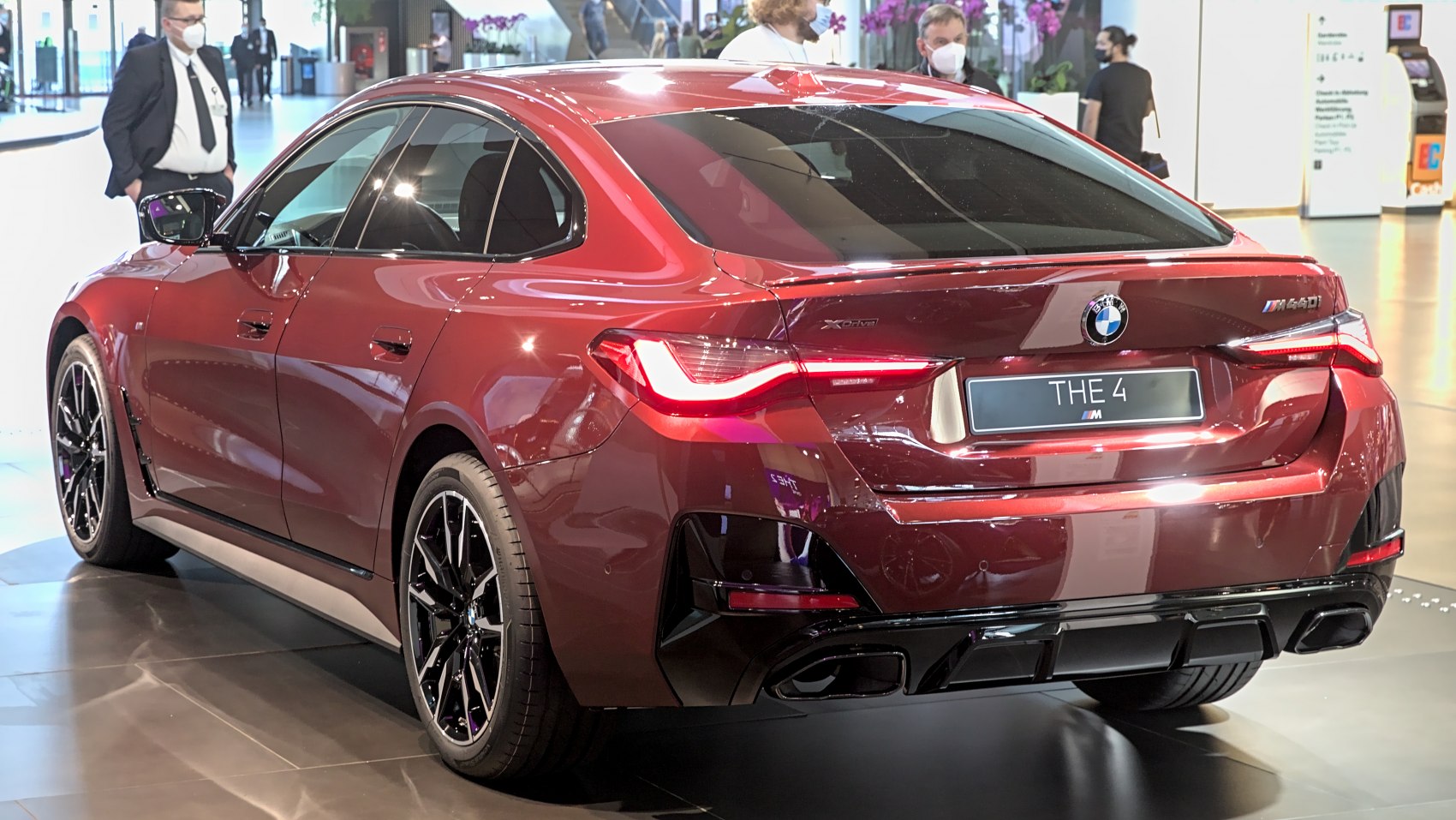 Rear view of a sporty sedan with LED taillights and black alloy wheels