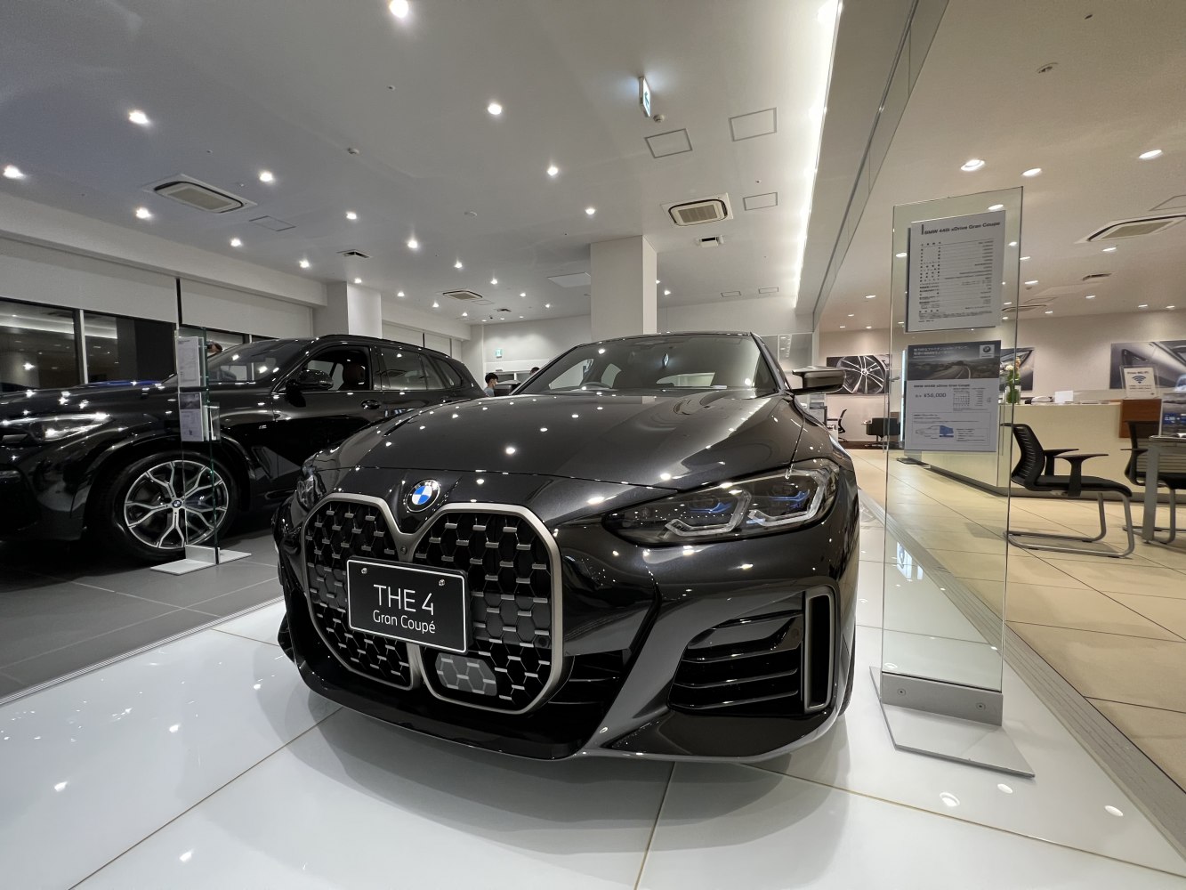 Front grille and sleek headlights of a modern luxury coupe