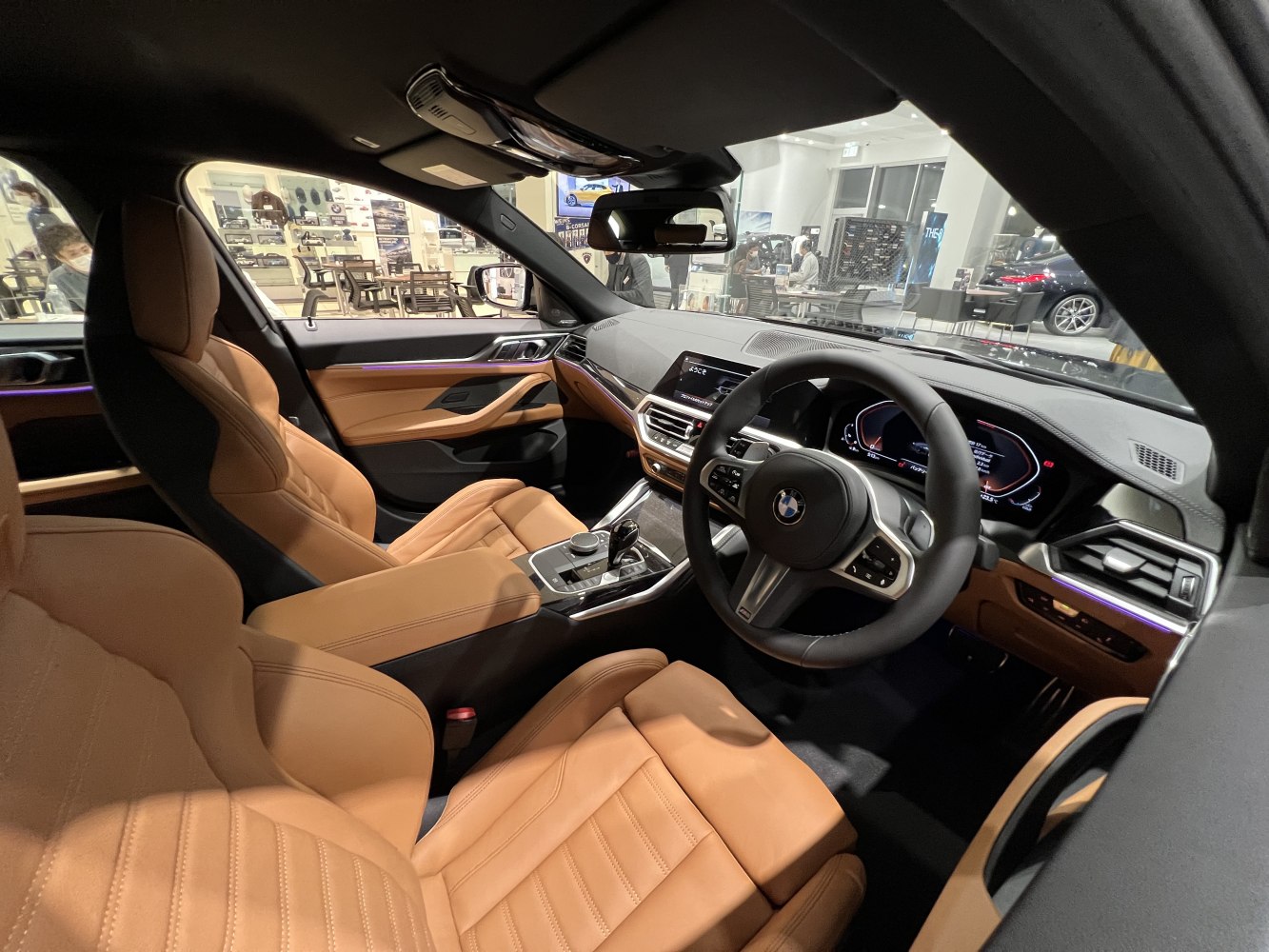 Tan leather seats with modern digital dashboard interior