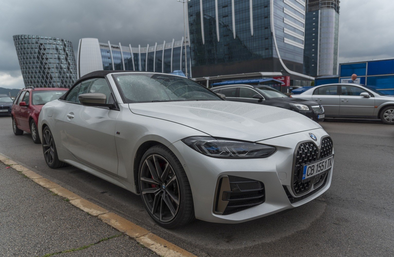 Front side view of convertible with soft top roof and sharp headlights