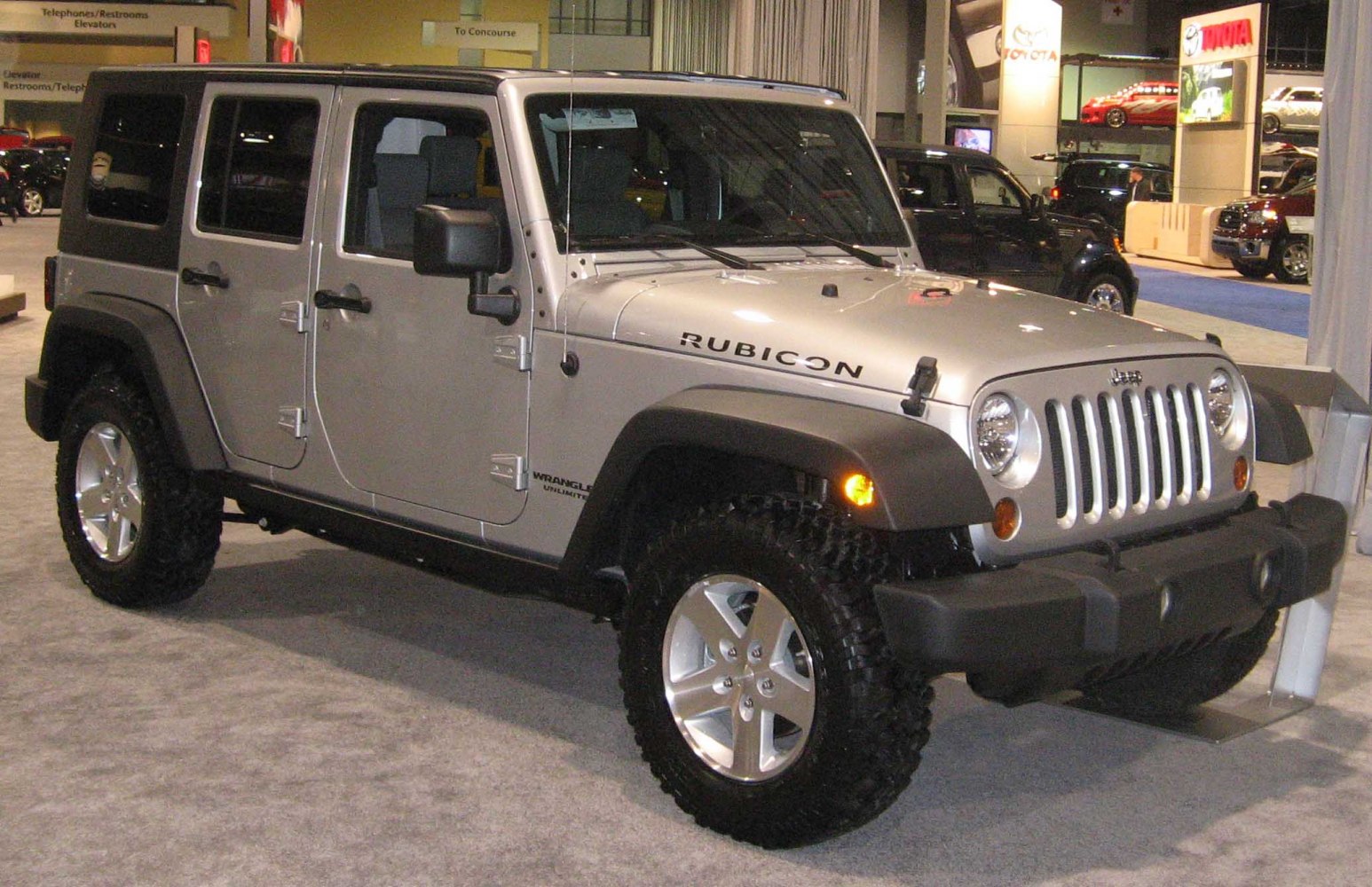 Four-door off-road SUV with rugged tires and bold front grille