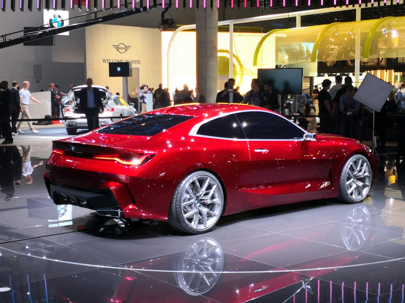 Red coupe with sharp rear and large alloy wheels
