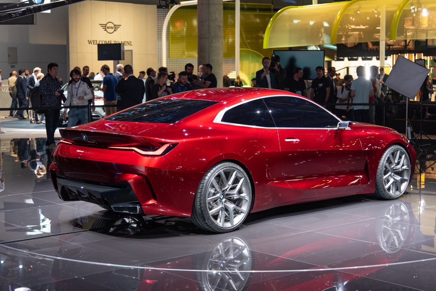 Sleek coupe rear and side profile showcasing aerodynamic body and large alloy wheels