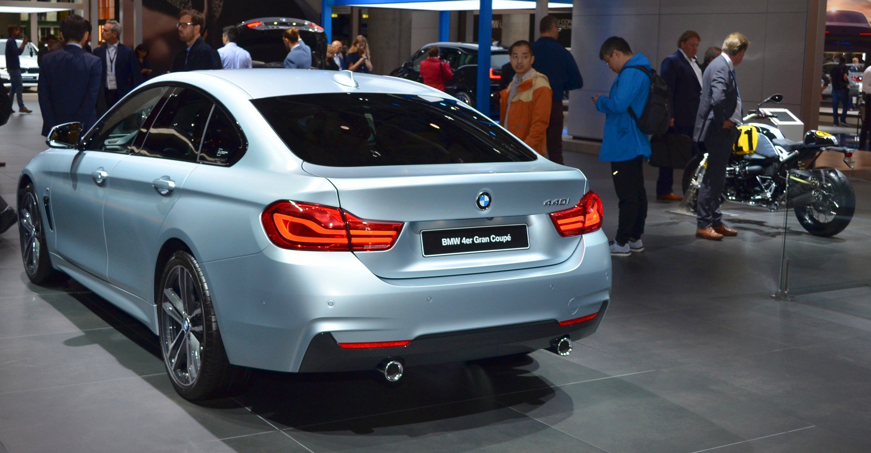 Rear view of sedan with distinctive tail lights and dual exhaust