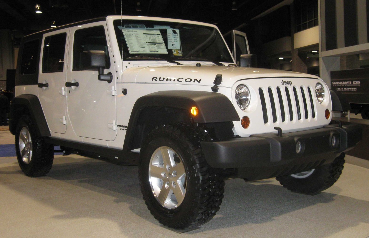 4x4 SUV with rugged off-road tires and classic round headlights