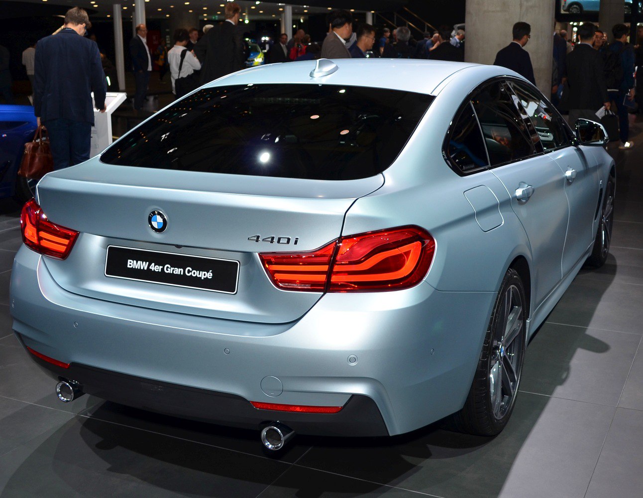 Rear view with distinctive taillights and dual exhausts on a sleek sedan