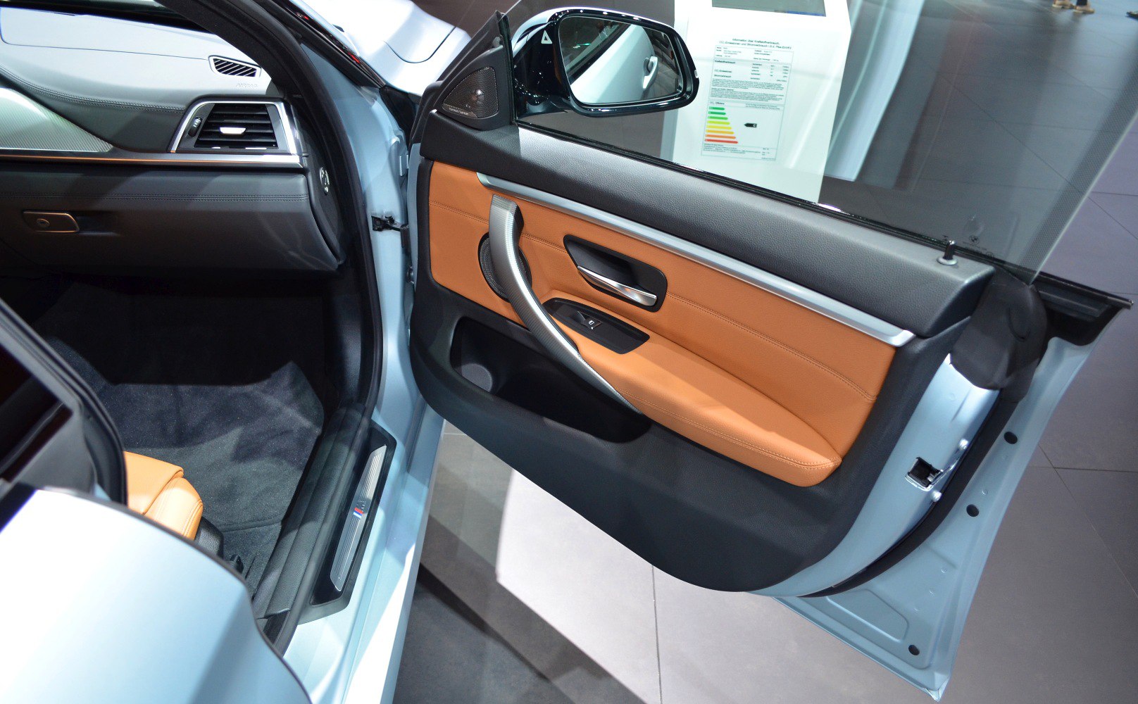 Interior door panel with leather and handle