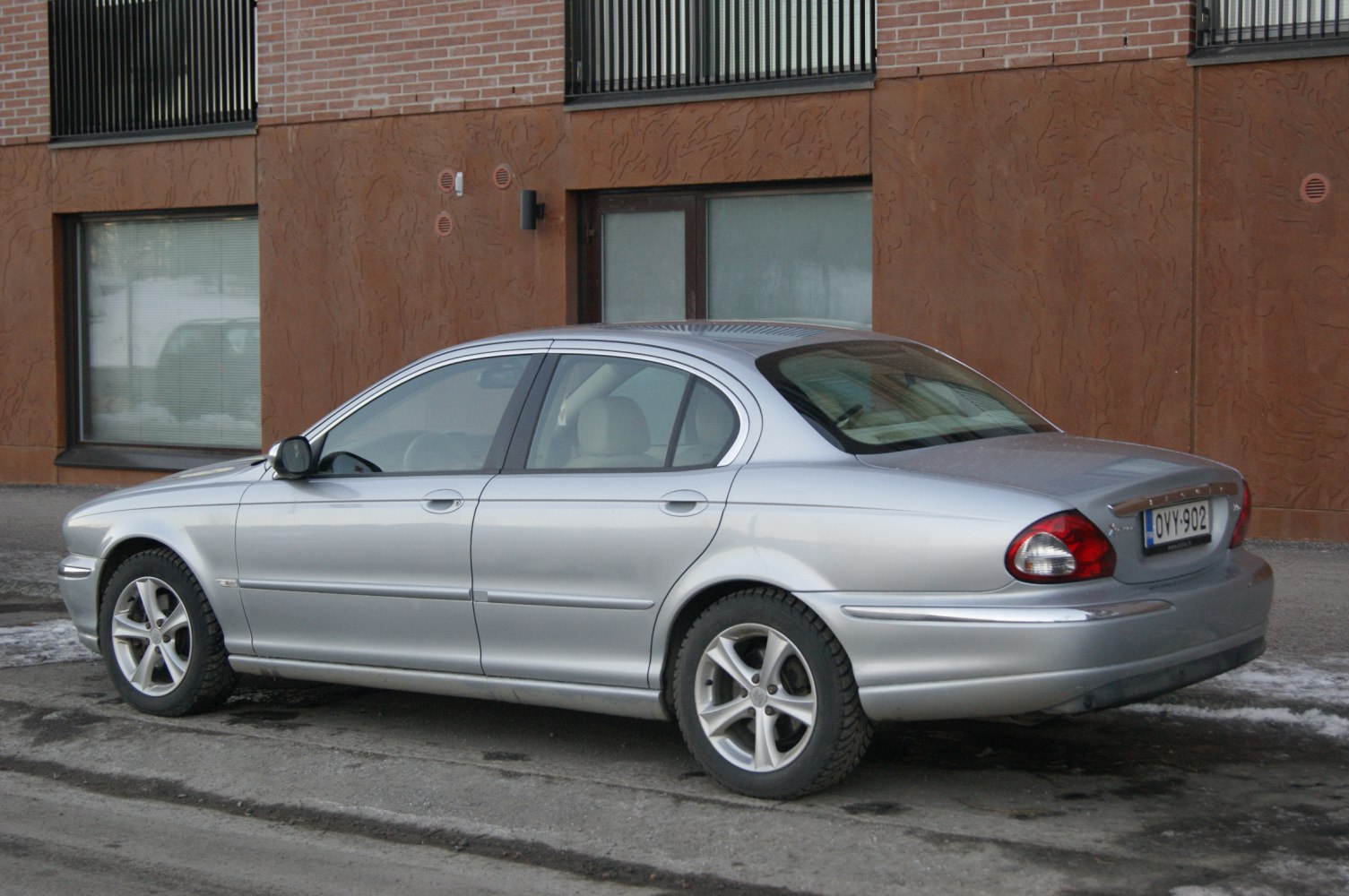 Silver sedan with rounded rear lights and alloy wheels