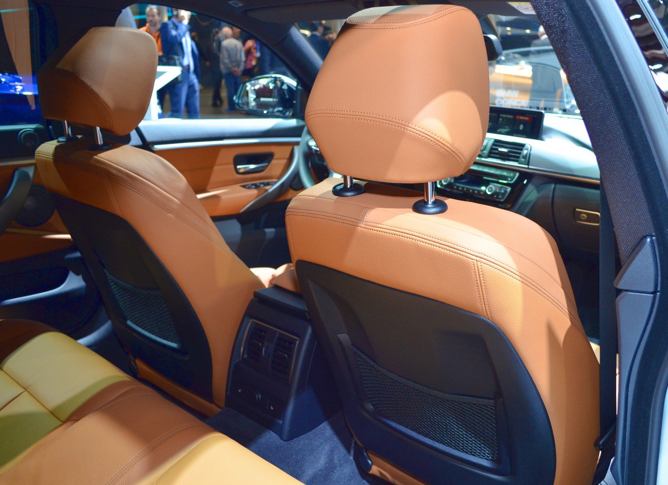 Rear interior view with tan leather seats and center air vents