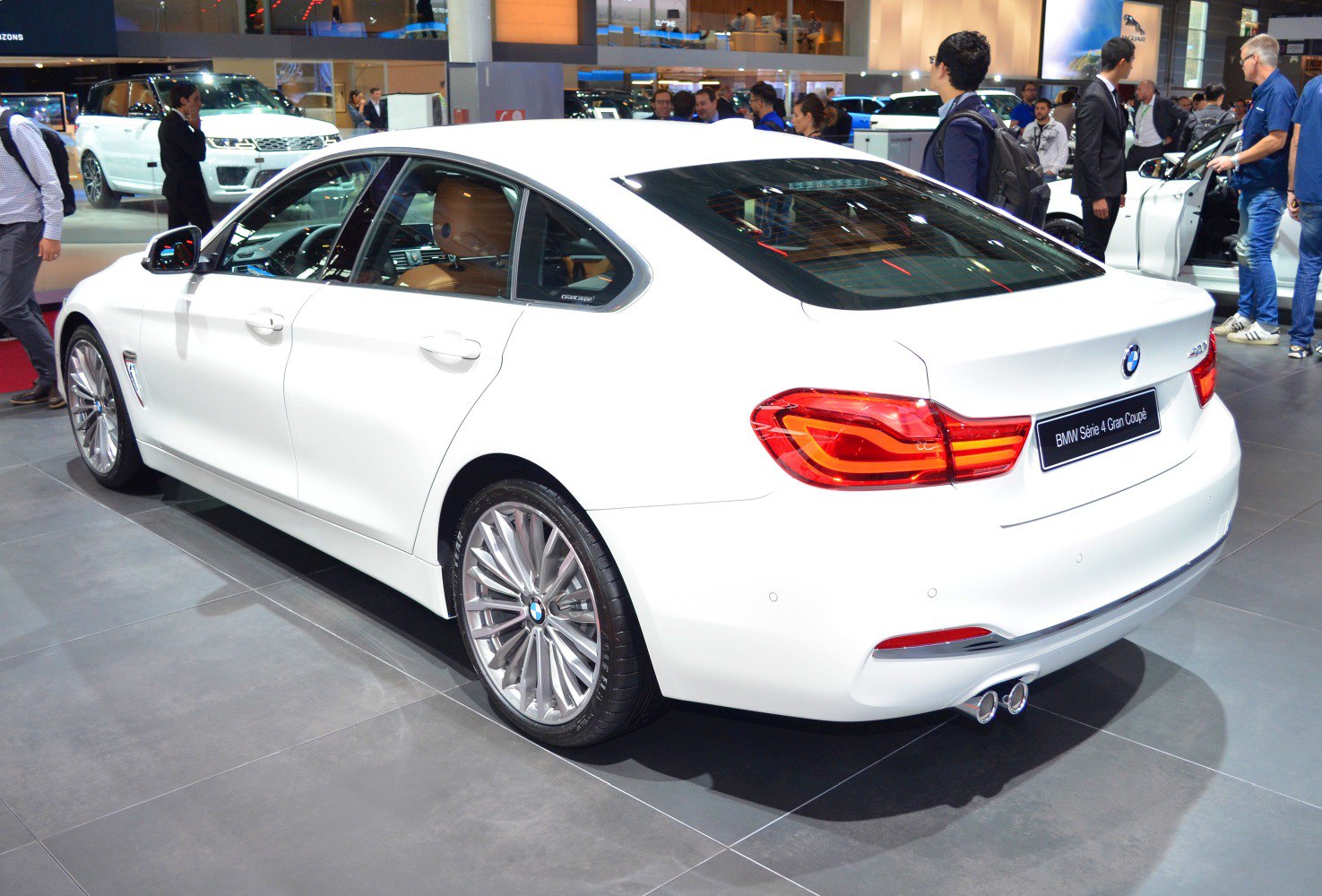 Rear profile and alloy wheels of a white 4-door Gran Coupe sedan
