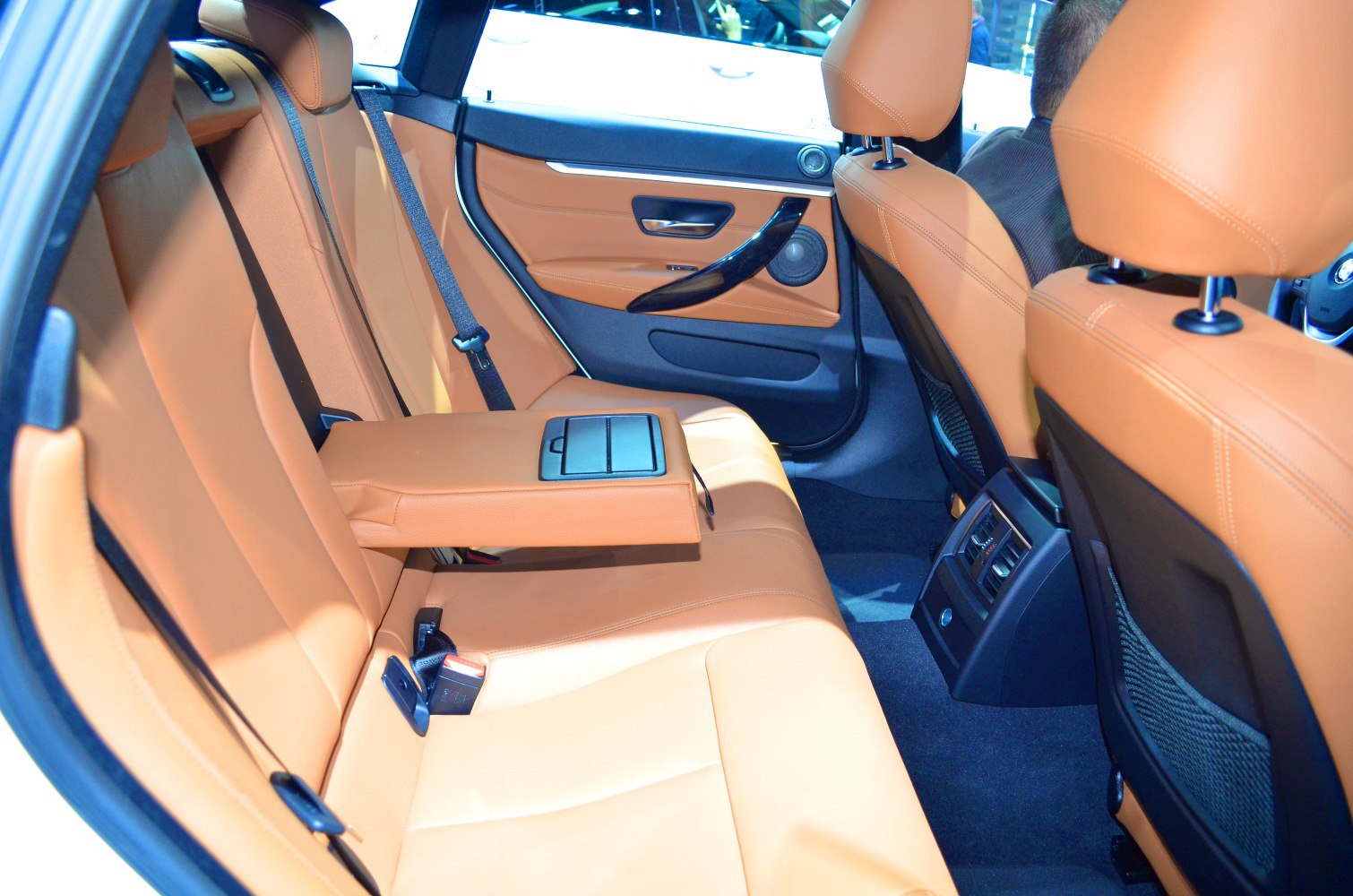 Rear seats with tan leather and foldable armrest
