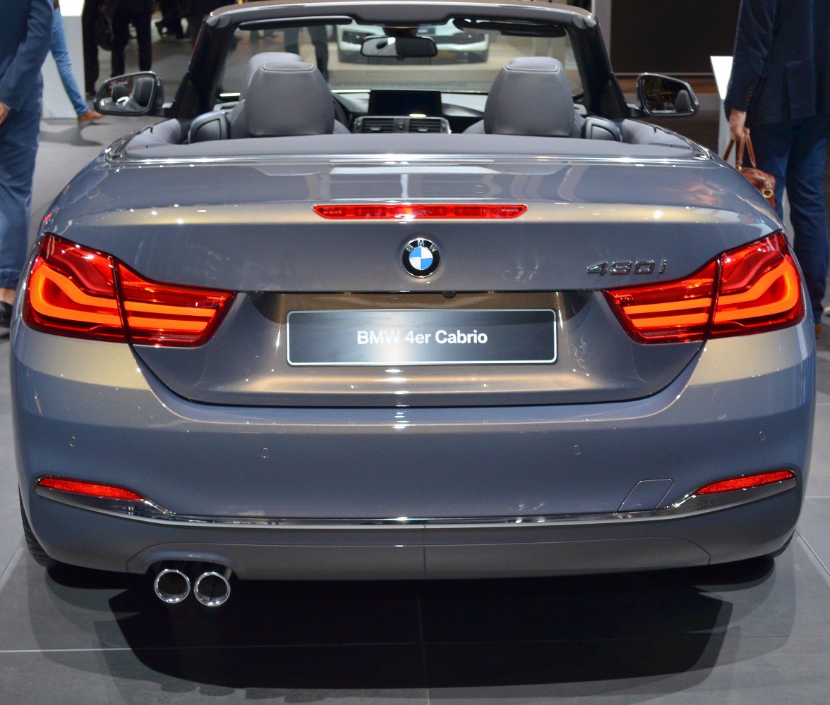 Rear view of convertible with LED tail lights and dual exhaust pipes