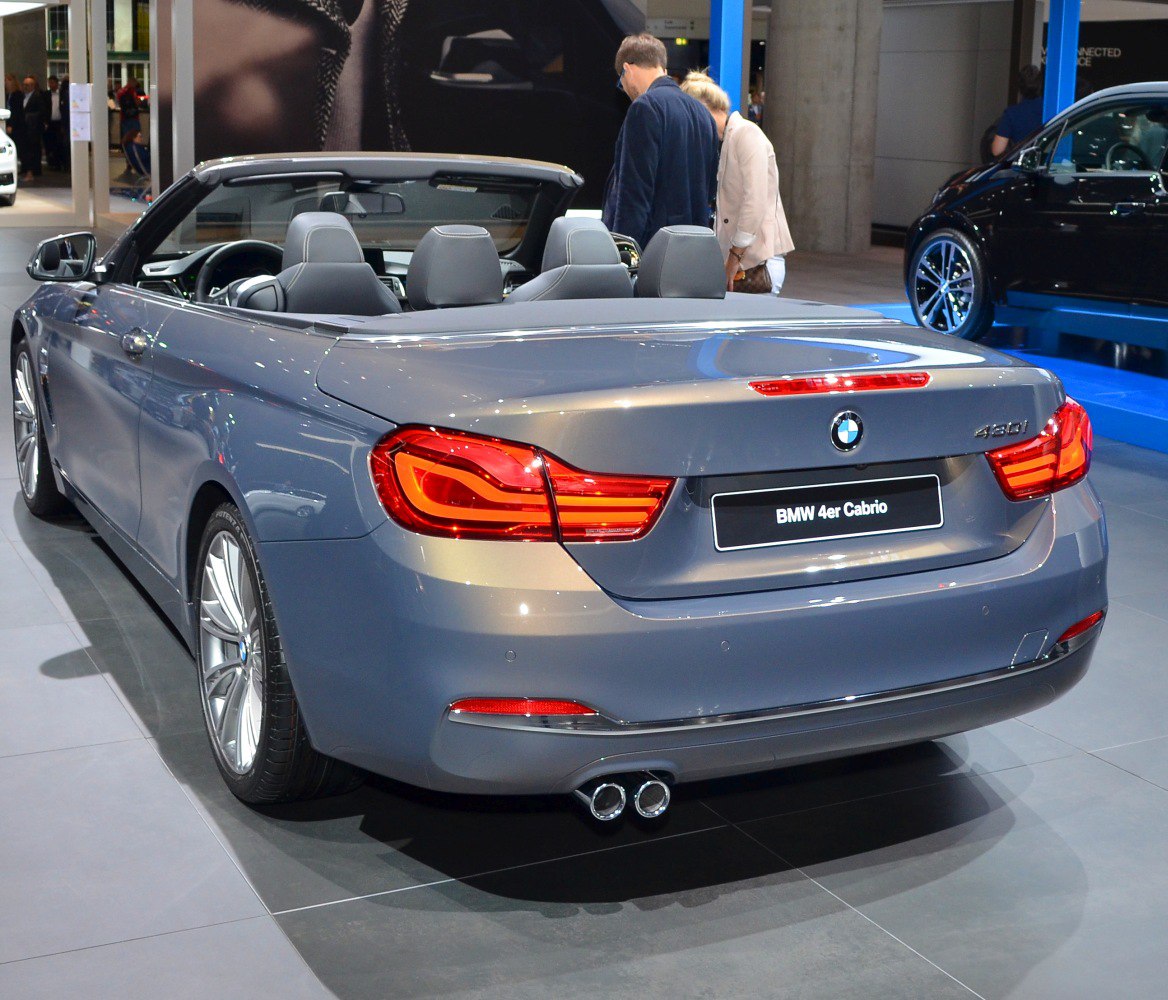 Rear view of convertible with distinctive taillights and dual exhausts