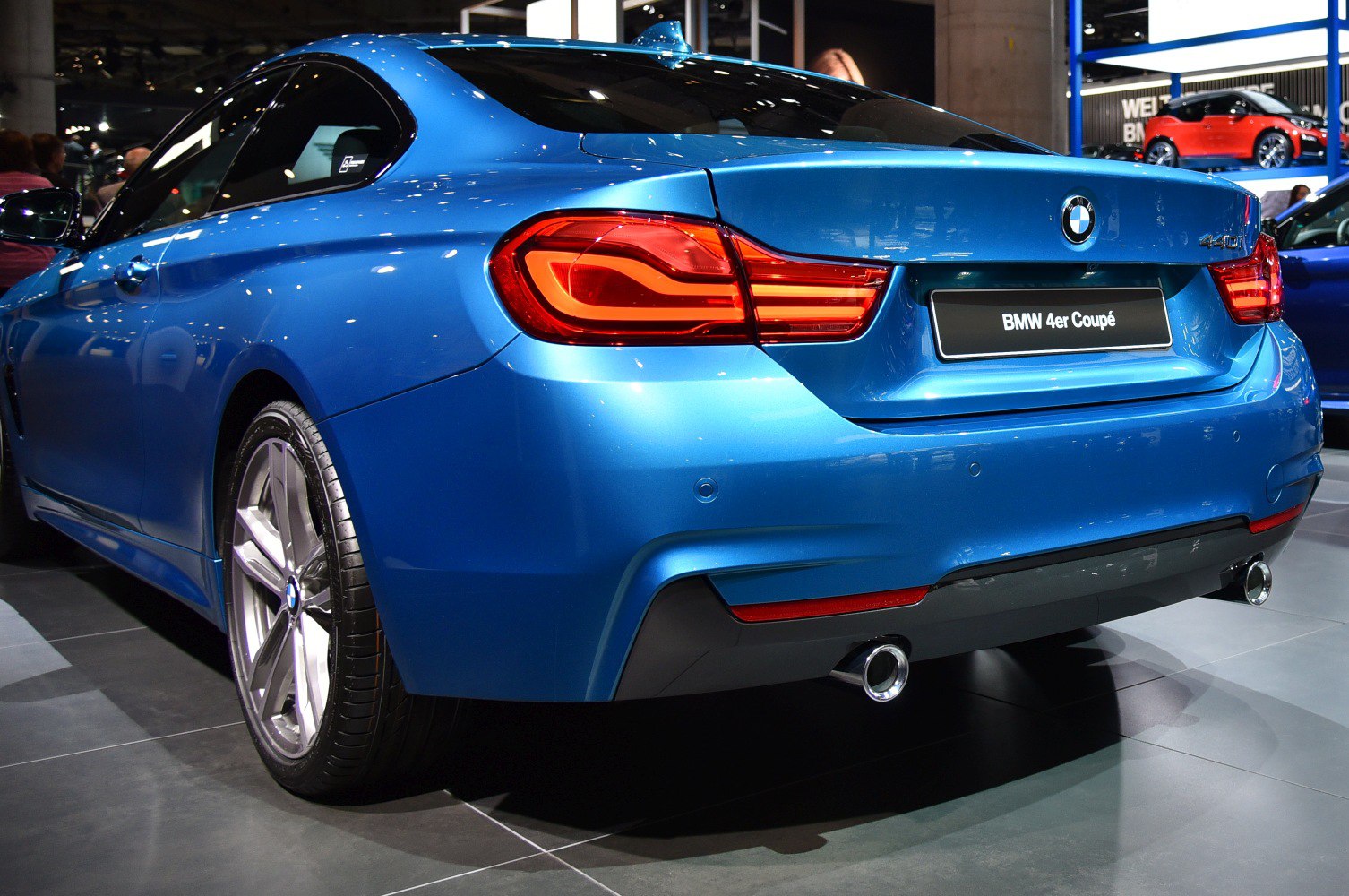 Rear view with distinct LED tail lights and dual exhaust pipes.
