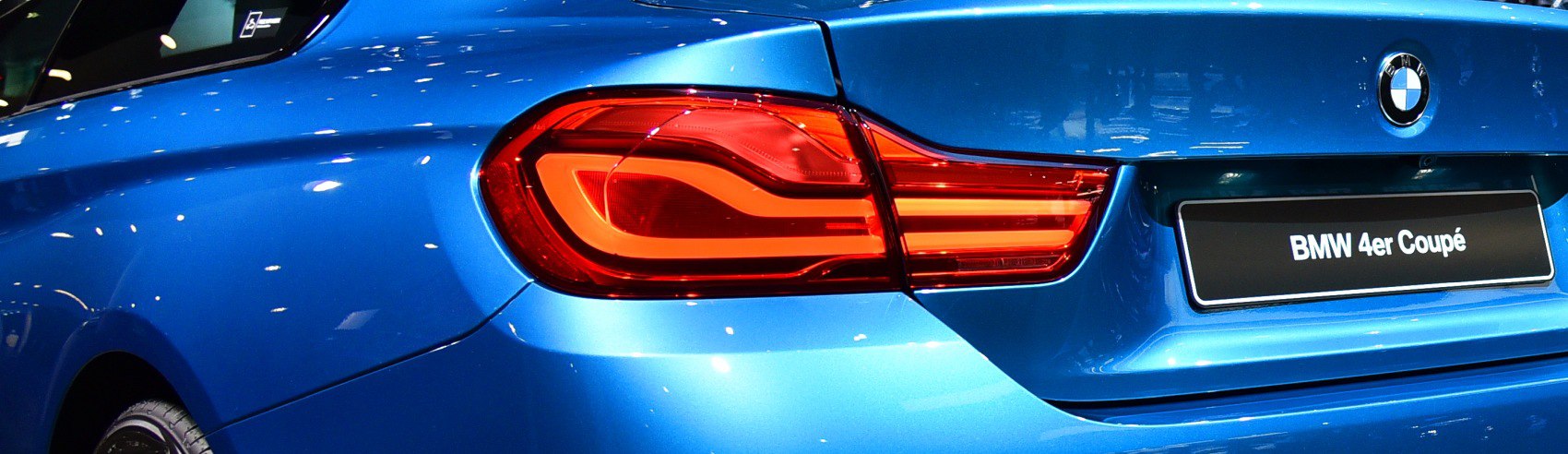 Close-up of BMW 4 Series F32 facelift rear LED tail light and trunk in blue