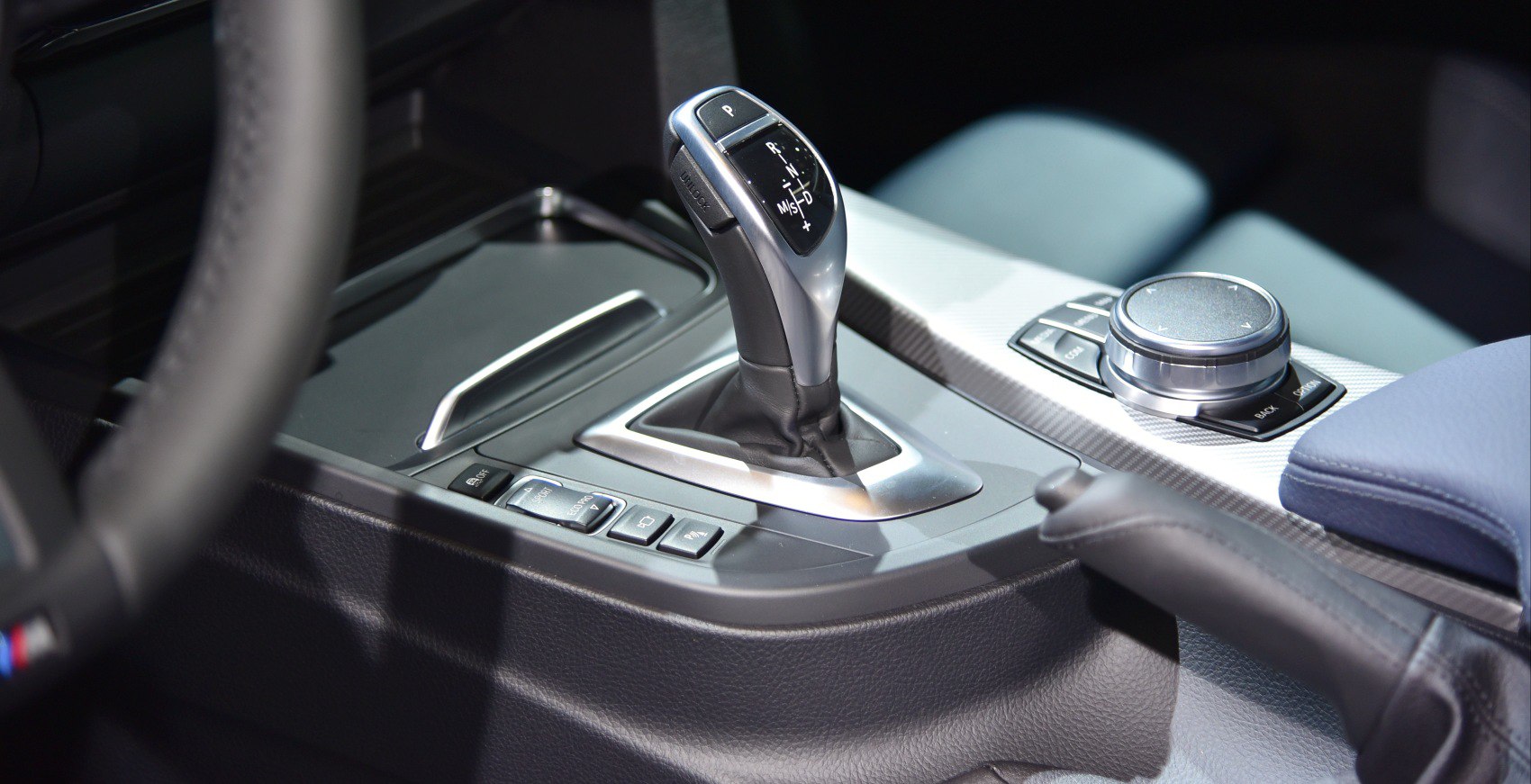 Automatic gear shift lever and control dial on car center console