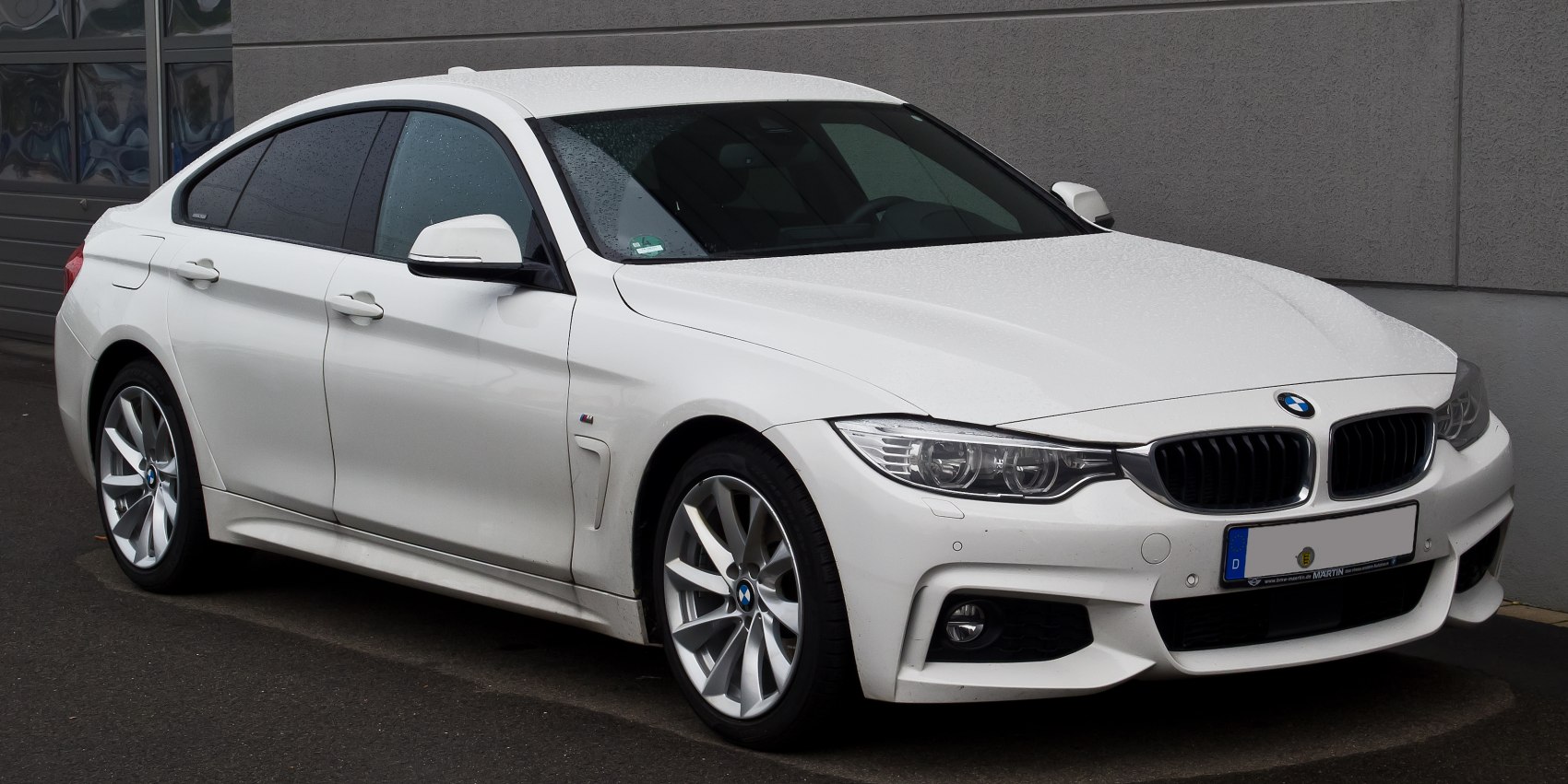 Front-side view of sporty luxury sedan with alloy wheels and sleek lines