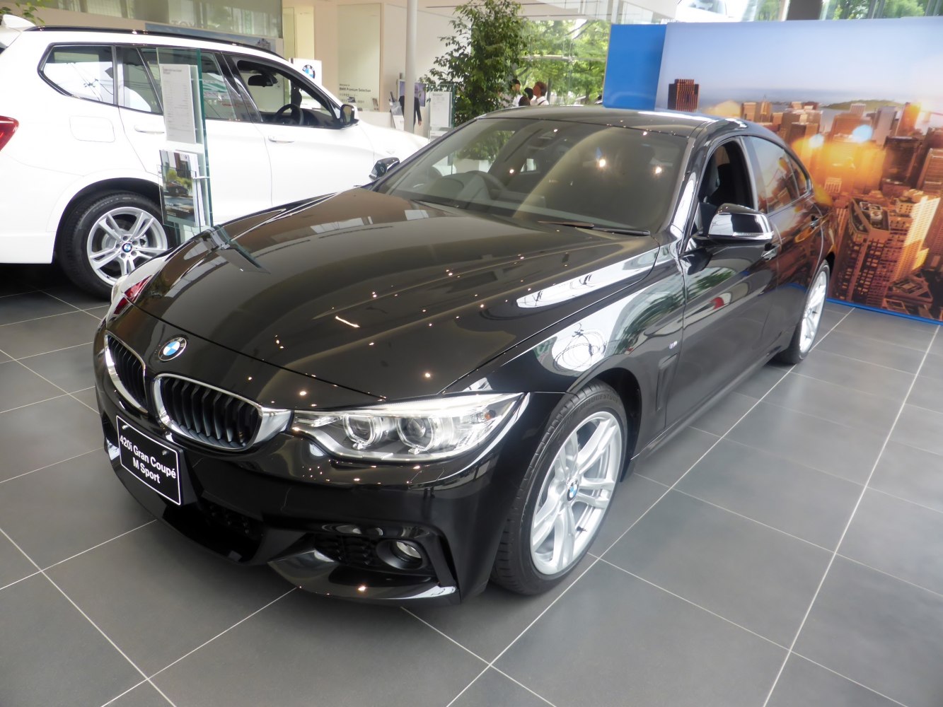 Black sedan with sporty front grille and headlights