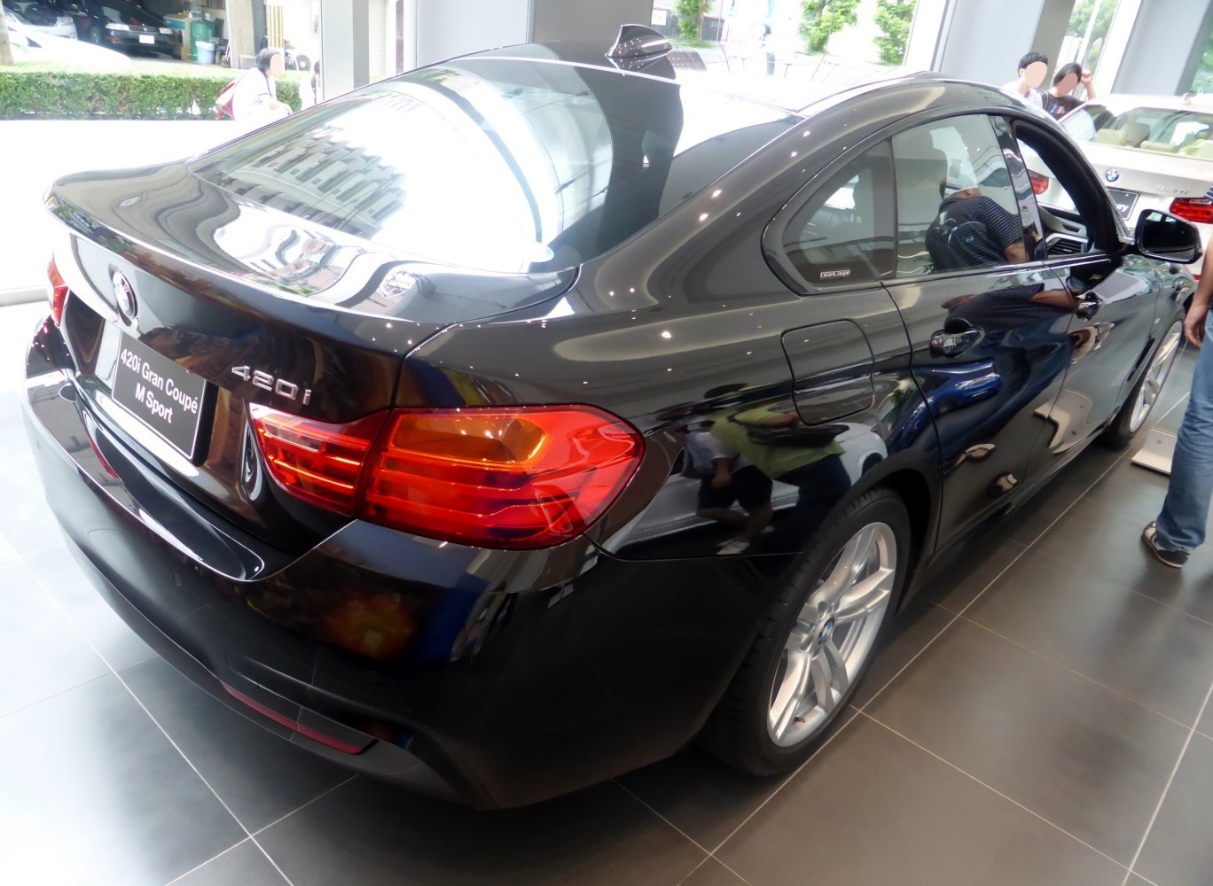 Rear and side view of BMW Gran Coupe 420i M Sport with tail lights