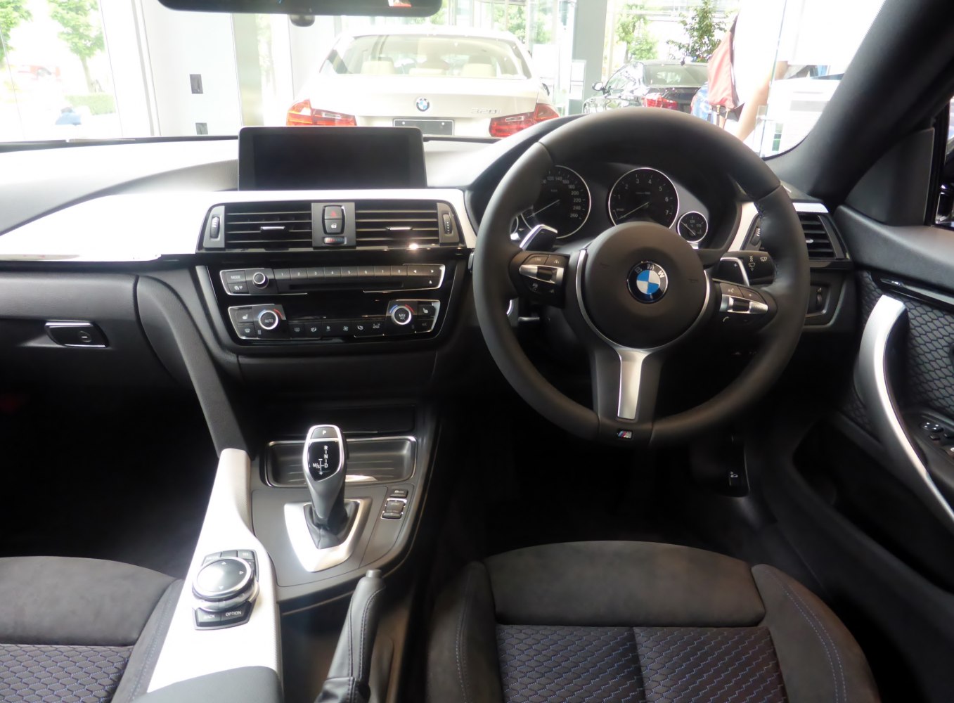 Interior dashboard with steering wheel and gear selector
