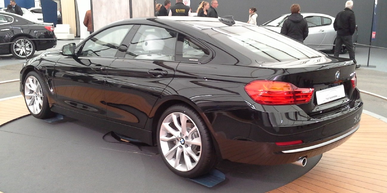Sleek rear side view with distinct taillights and alloy wheels