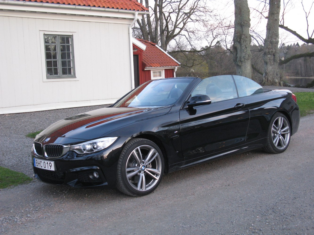 Black convertible with sporty wheels and aerodynamic design