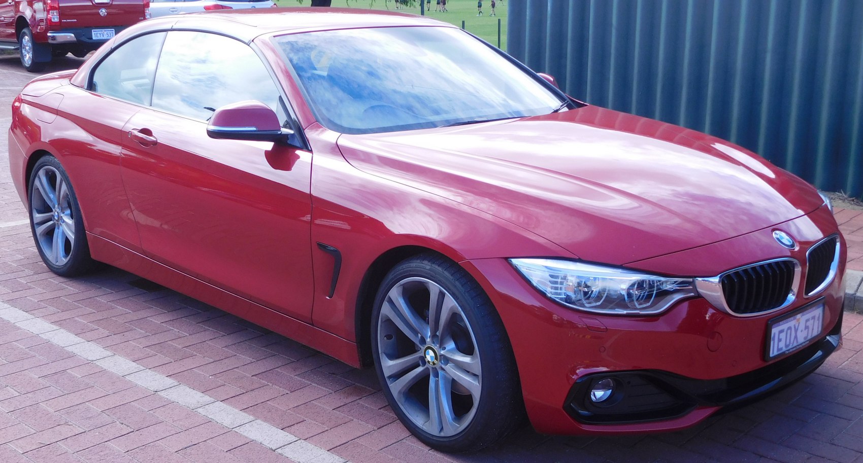 Front side view with alloy wheels and headlight design of a sporty convertible
