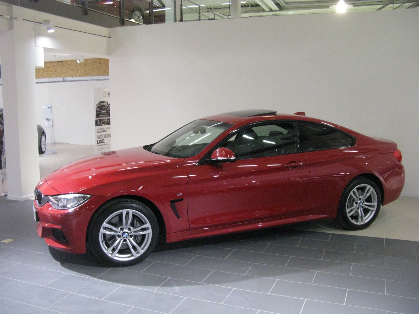 Side profile of a coupe with sunroof.