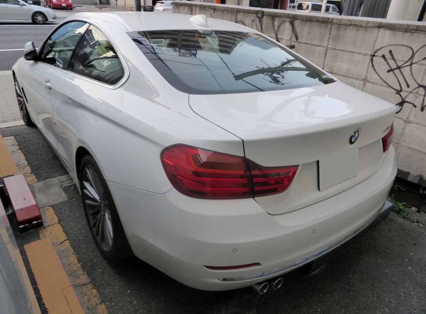 Rear view showing taillights, exhaust, and smooth rear contours