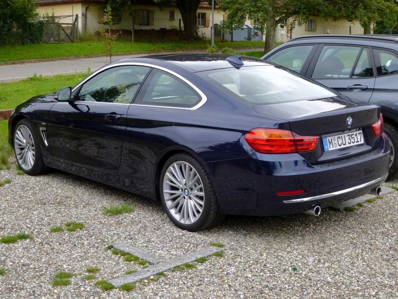 Rear and side profile with distinct tail lights and dual exhaust