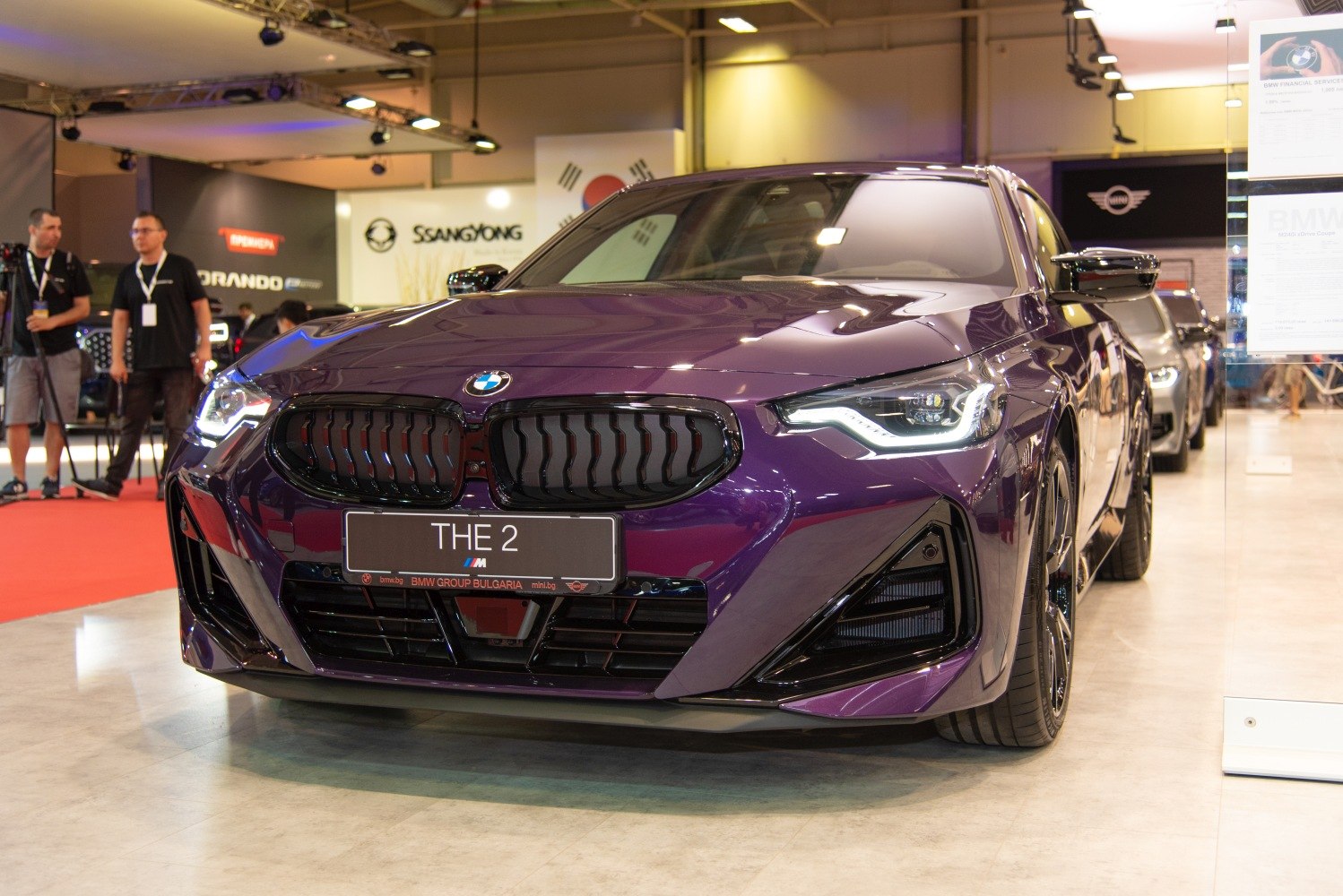 Close-up of front grille and LED headlights in purple