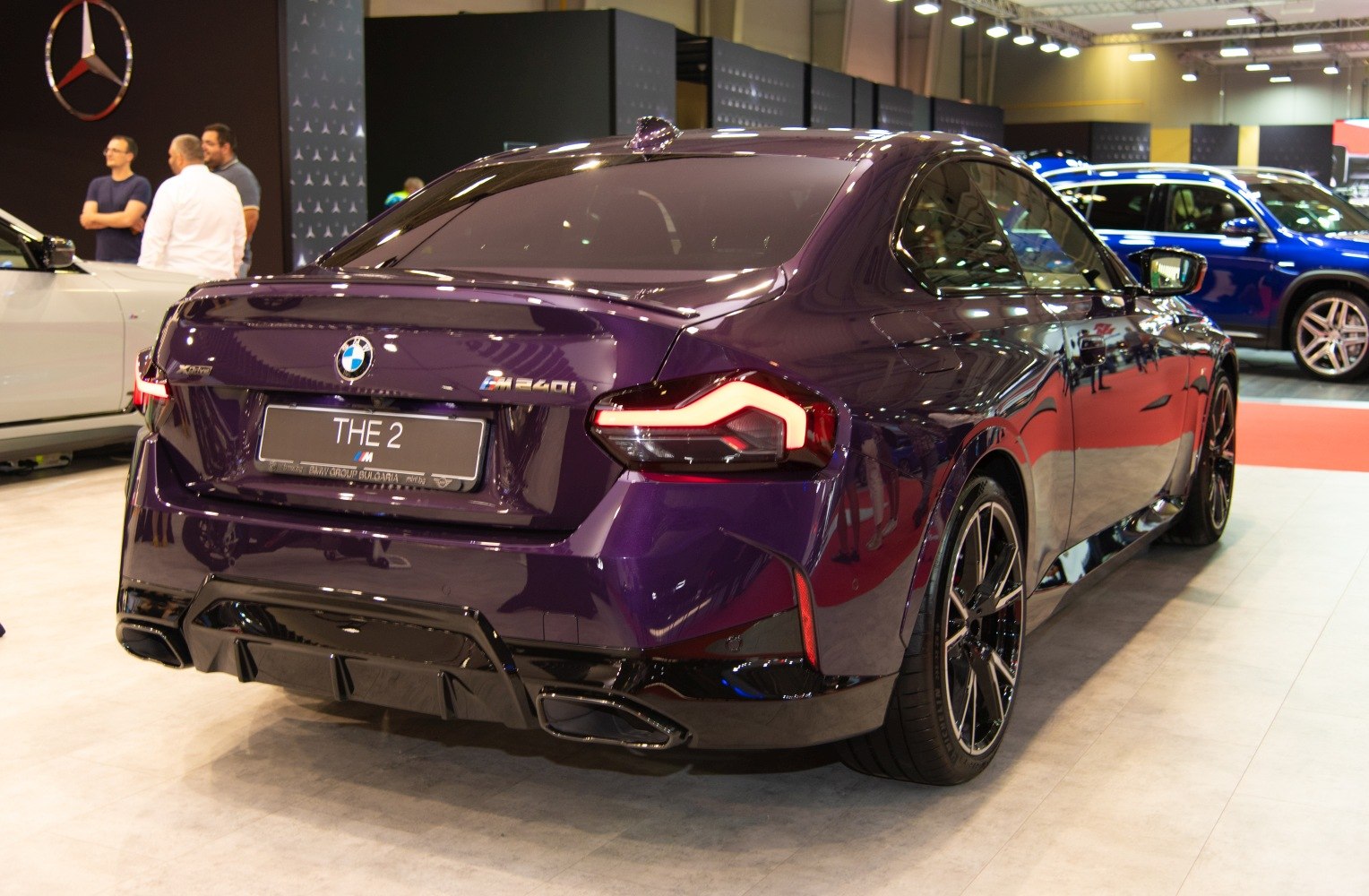 Sporty rear view with distinctive taillights and dual exhausts
