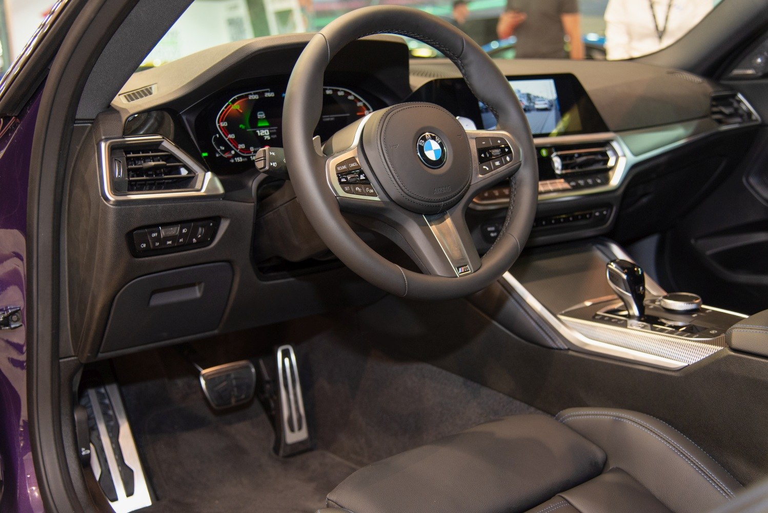 Modern luxury car interior with multifunction steering and digital dashboard