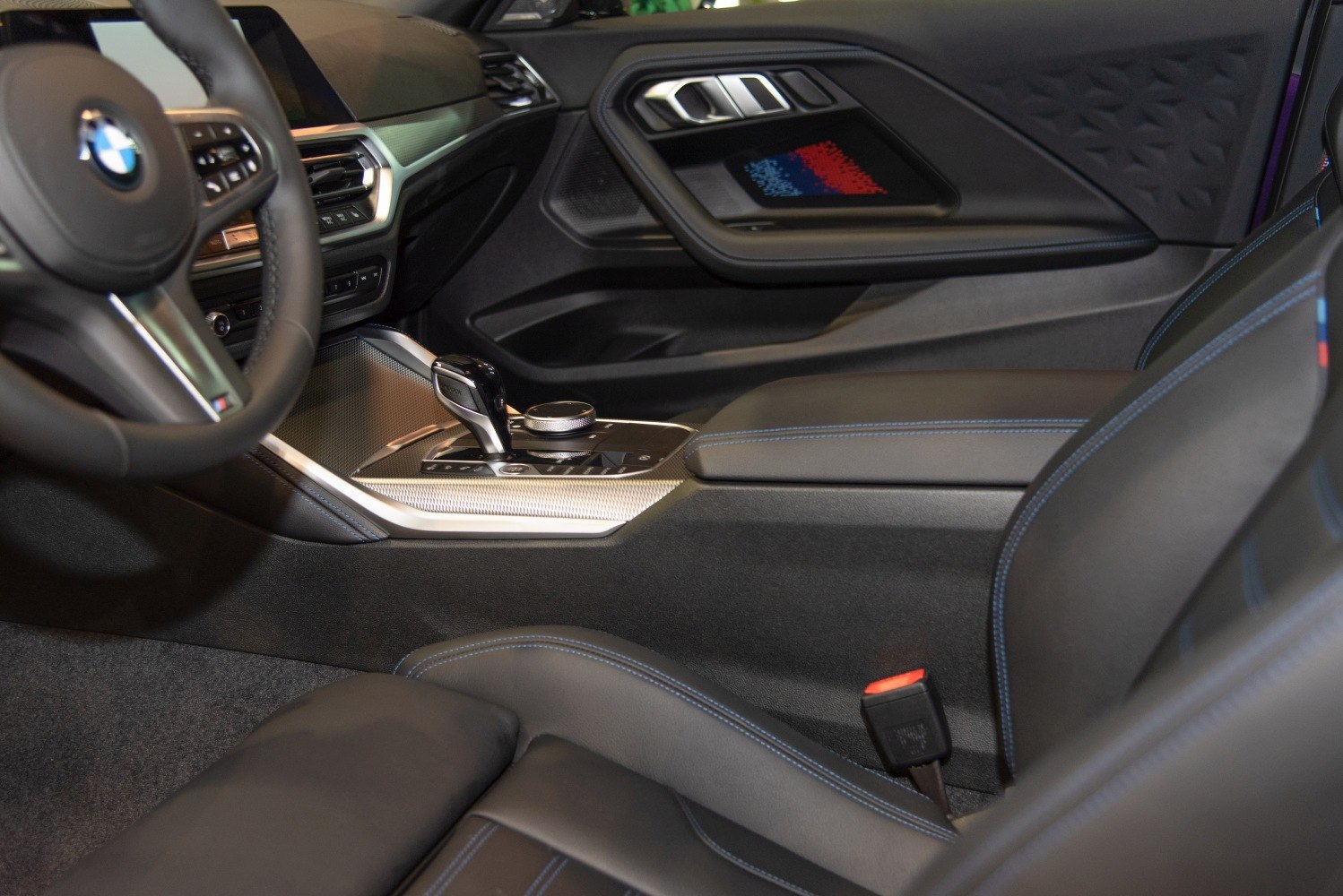 Luxury car interior with advanced controls and premium upholstery stitching