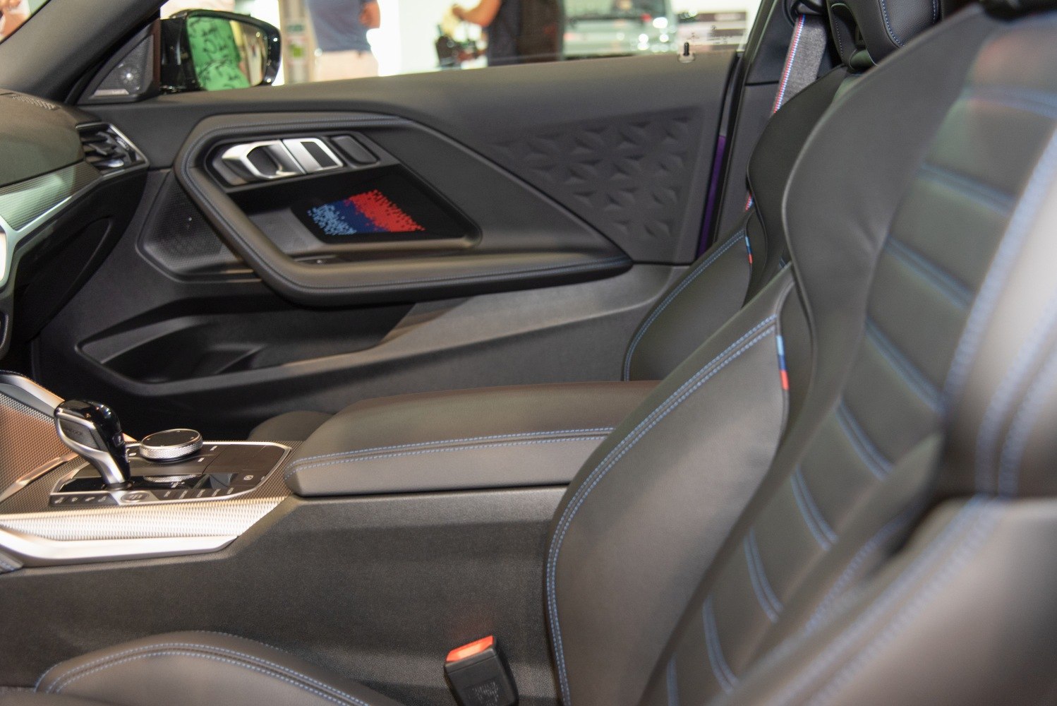 Sporty leather seats and detailed door panel in modern car interior