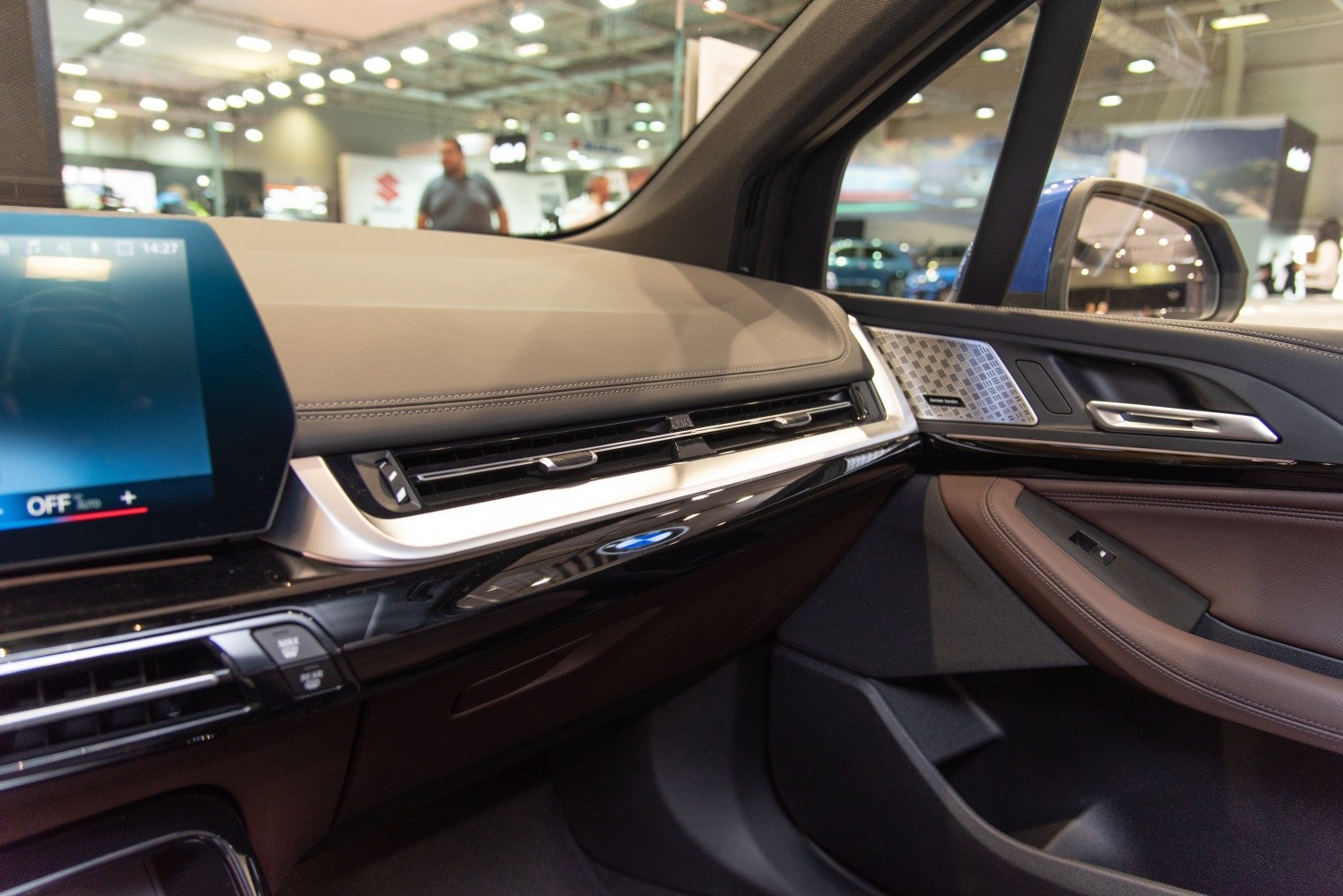 Modern car interior dashboard with infotainment screen and door panel