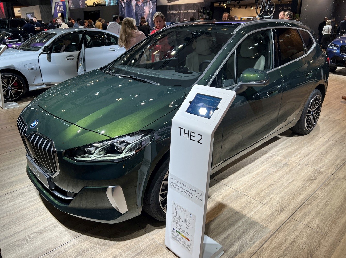 Front left view of green compact MPV with LED headlights and kidney grille