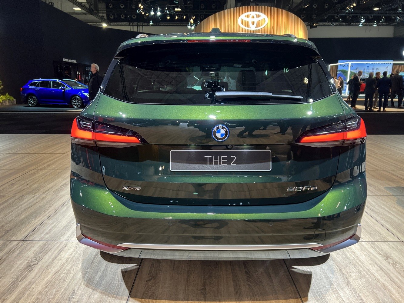 Rear view of a modern car with sleek tail lights and aerodynamic rear design.